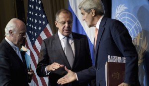 UN Special Envoy for Syria de Mistura watches as Russian Foreign Minister Lavrov and US Secretary of State Kerry shake hands after a news conference at the Grand Hotel, in Vienna
